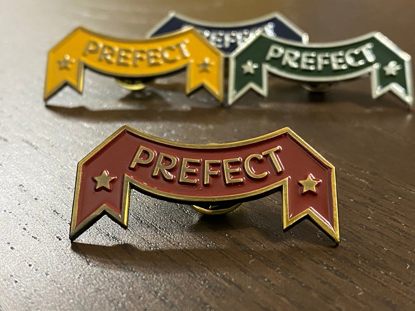 Vintage garnet and gold prefect pin magical world